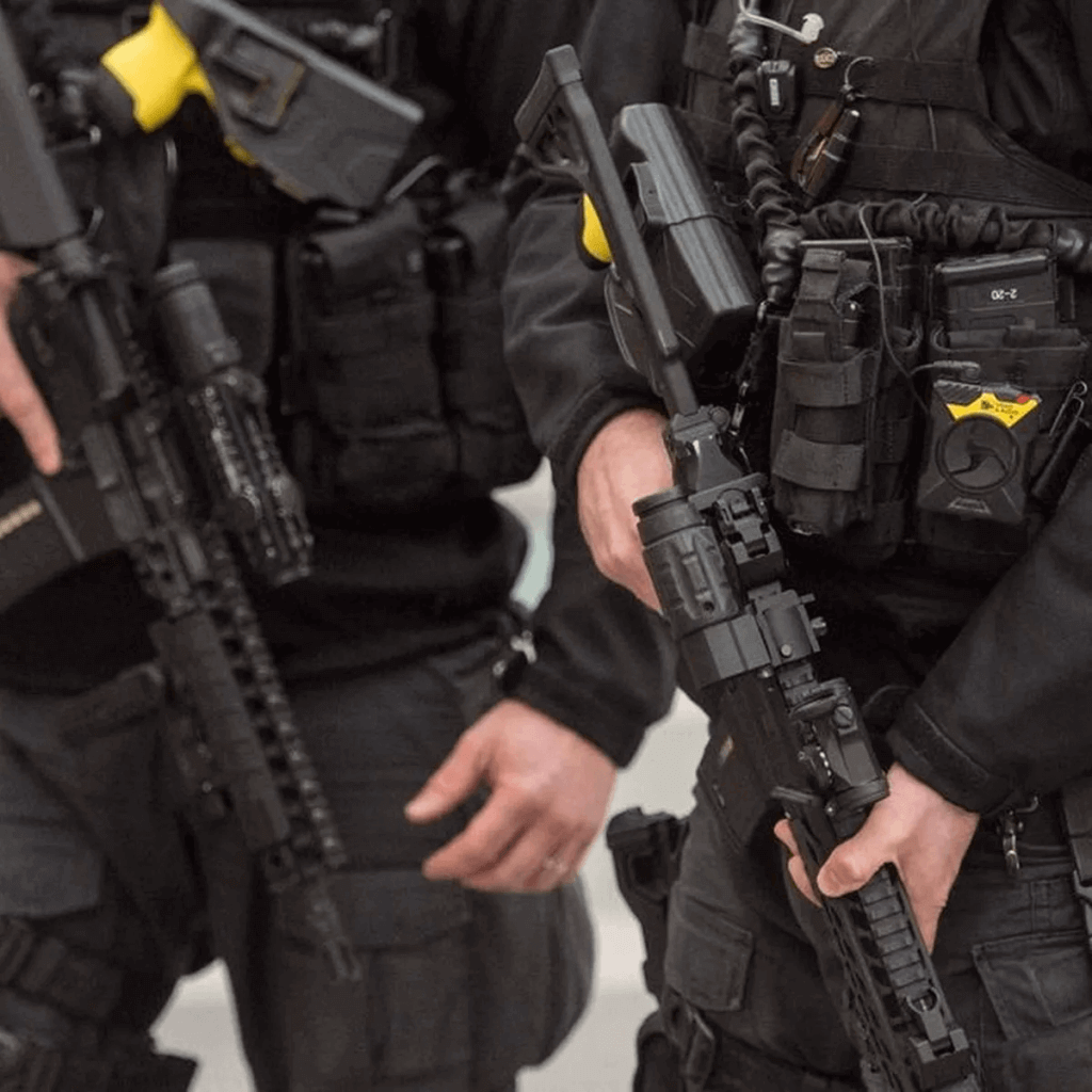 Close-up of tactical enforcement officers in professional gear, highlighting the specialist training and high-risk task capability of South East Enforcement.