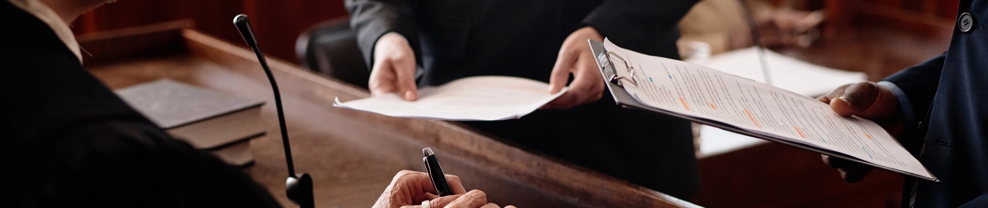 Security personnel handling legal documents and compliance paperwork in professional setting